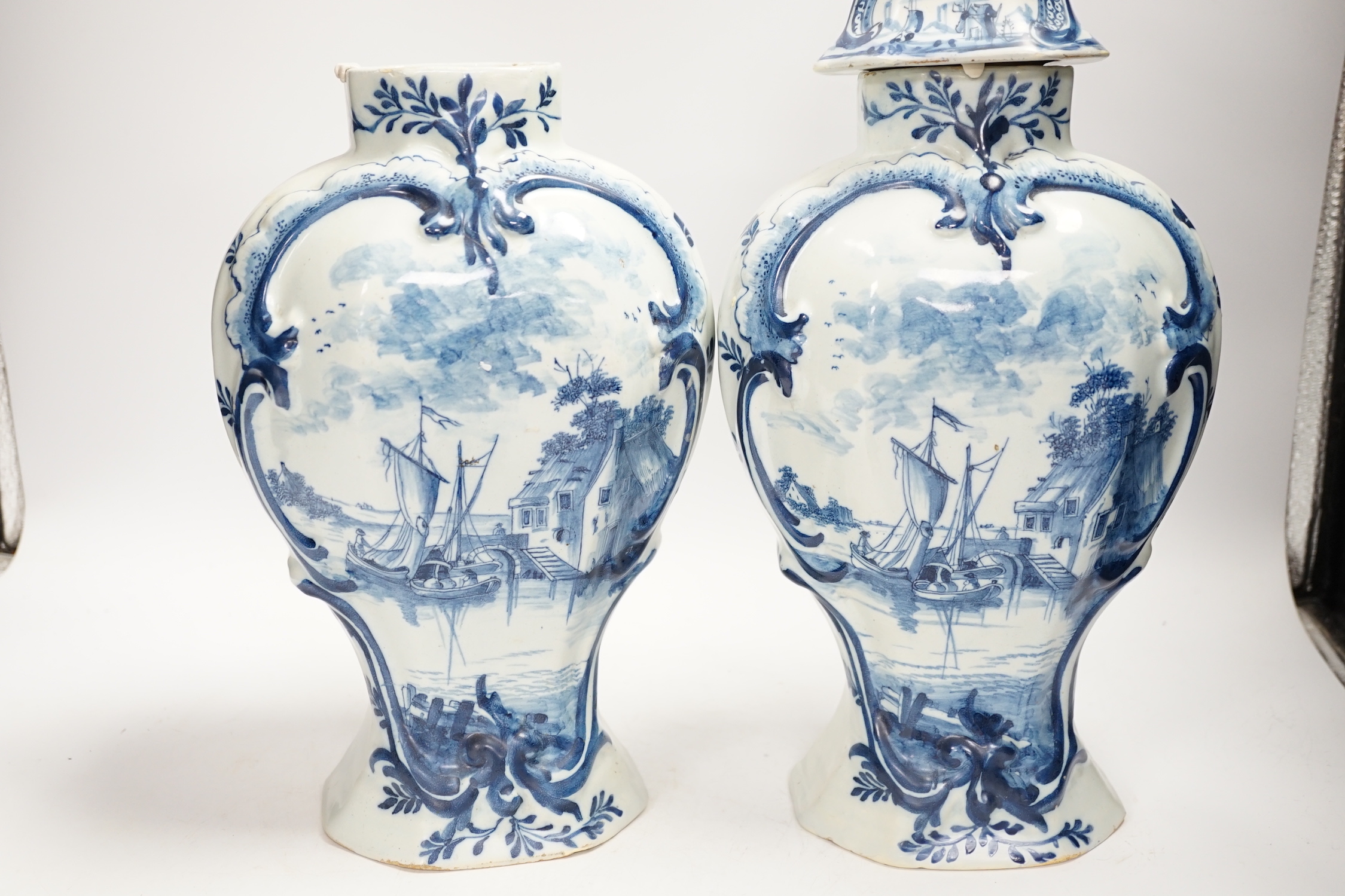 A Delft garniture of three vases, c.1770, tallest 41cm high
